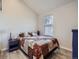 Bedroom featuring hardwood floors, natural light, and neutral colors at 6332 Zang Court # A, Arvada, CO 80004