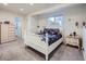 Charming bedroom with a white wood bed frame, soft carpet, and a light wood dresser at 6332 Zang Court # A, Arvada, CO 80004