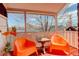 Inviting balcony with orange chairs, a small table, and a view of the neighborhood at 404 S Grant St, Denver, CO 80209