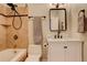 Well-lit bathroom with a shower/tub combo, stylish marble tile, and modern fixtures at 404 S Grant St, Denver, CO 80209