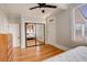 Spacious bedroom featuring natural light and closet with mirrored doors at 404 S Grant St, Denver, CO 80209