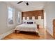 Cozy bedroom with a brick accent wall and great natural light at 404 S Grant St, Denver, CO 80209