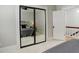 Bedroom with mirrored closet doors, a ceiling fan, and a view into the hall at 404 S Grant St, Denver, CO 80209