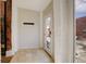 Hallway with coat hooks, tile floors, and a glass front door to the outside at 404 S Grant St, Denver, CO 80209