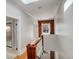 Upstairs hallway features a wooden banister and exposed brick at 404 S Grant St, Denver, CO 80209