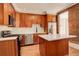 A renovated kitchen with custom cabinets, stainless appliances, and an island at 404 S Grant St, Denver, CO 80209