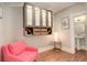 Bright and inviting sitting room featuring a comfortable pink chair and modern wall decor at 404 S Grant St, Denver, CO 80209