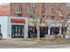 Street view of commercial buildings featuring various eateries with outdoor dining areas on a sunny day at 404 S Grant St, Denver, CO 80209