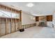 Spacious basement area with a brick fireplace, exposed framing, and ample room for customization and development at 219 Douglas Fir Ave, Castle Rock, CO 80104