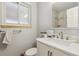 Bathroom featuring a modern vanity, brushed nickel fixtures, and tile shower, offering a clean, updated space at 219 Douglas Fir Ave, Castle Rock, CO 80104