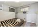 Bedroom with gray carpet, half-wall trim, closet and an egress window at 219 Douglas Fir Ave, Castle Rock, CO 80104