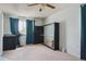 Cozy bedroom with bright window, ceiling fan, and versatile Murphy bed, offering both space and functionality at 219 Douglas Fir Ave, Castle Rock, CO 80104