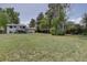 This home offers a spacious backyard featuring mature trees, a shed and a deck, ideal for outdoor living at 5945 W 86Th Ave, Arvada, CO 80003