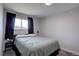 Cozy bedroom featuring a large window and modern decor at 5945 W 86Th Ave, Arvada, CO 80003