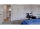 Bright bedroom with an office space, featuring natural light and neutral tones at 5945 W 86Th Ave, Arvada, CO 80003