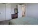 This bedroom features a large closet, and light green bedding at 5945 W 86Th Ave, Arvada, CO 80003