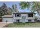 Charming two-story home featuring a well-maintained front yard and attached garage at 5945 W 86Th Ave, Arvada, CO 80003