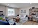 Bright living room featuring neutral walls, light hardwood floors, and stylish furniture at 5945 W 86Th Ave, Arvada, CO 80003