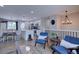 Open-concept living space combining kitchen, dining, and living areas with modern decor at 5945 W 86Th Ave, Arvada, CO 80003