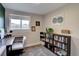 The office space features an organized shelving unit and natural light at 5945 W 86Th Ave, Arvada, CO 80003