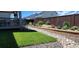 Backyard features a green lawn, professional landscaping, and a privacy fence at 14551 Hudson St, Thornton, CO 80602