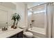Clean bathroom with a shower-tub combo, a neutral color palette, and a sleek vanity at 14551 Hudson St, Thornton, CO 80602