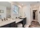 A well-lit bathroom with double sinks, a vanity area, and a modern design that offers plenty of space at 14551 Hudson St, Thornton, CO 80602