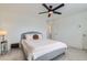 Neutral bedroom with a ceiling fan, plush carpeting, and a calming ambiance for relaxation at 14551 Hudson St, Thornton, CO 80602