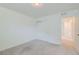 Simple bedroom with a closet with sliding doors and an adjacent bathroom visible at 14551 Hudson St, Thornton, CO 80602