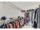 A walk-in closet with ample storage, featuring multiple rods and shelves, perfect for organizing clothes and accessories at 14551 Hudson St, Thornton, CO 80602