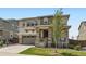 Charming two-story home with a stone-accented porch, neat lawn, and attached two-car garage at 14551 Hudson St, Thornton, CO 80602
