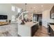 Modern kitchen boasts a large center island, stainless appliances, and open layout at 14551 Hudson St, Thornton, CO 80602