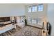 An open-concept living room with soaring ceilings, large windows, and stylish decor, perfect for relaxation and entertainment at 14551 Hudson St, Thornton, CO 80602
