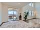 Bright living room with hardwood floors and access to the outdoor deck with seating at 14551 Hudson St, Thornton, CO 80602