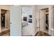 An airy shot of the main bedroom, revealing access to both the walk-in closet and a bright, stylish en-suite bathroom at 14551 Hudson St, Thornton, CO 80602