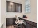 A functional office space featuring built-in cabinets, a sleek countertop, and a comfortable ergonomic chair at 14551 Hudson St, Thornton, CO 80602