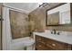 Stylish bathroom boasts tiled walls, decorative pebble accents, and modern vanity at 14396 E Temple Pl # D, Aurora, CO 80015