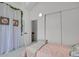 Bedroom features soft carpet, draped curtains, and a double door closet at 14396 E Temple Pl # D, Aurora, CO 80015