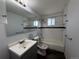 Clean bathroom with subway tile, new fixtures, and plenty of light at 4670 Independence St, Wheat Ridge, CO 80033
