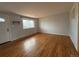 Inviting living room featuring hardwood floors, a large window, and neutral paint at 4670 Independence St, Wheat Ridge, CO 80033