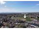 Aerial view showcasing O'Kane Park surrounded by a neighborhood and distant mountains at 25 Kendall St, Lakewood, CO 80226