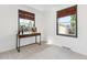 Cozy bedroom with carpet and two windows with woven shades allowing for natural light at 25 Kendall St, Lakewood, CO 80226