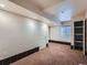 Partially finished basement area with a window and new paint ready to customize at 5553 Jasper St, Denver, CO 80239