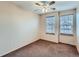 Bedroom with neutral walls, carpet flooring, and a window offering plenty of natural light at 5553 Jasper St, Denver, CO 80239