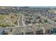 Extensive aerial view of a residential community, with houses, streets, and green spaces at 2177 Shadow Creek Dr, Castle Rock, CO 80104