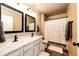Well-lit bathroom featuring double vanity, shower, and neutral decor at 2177 Shadow Creek Dr, Castle Rock, CO 80104