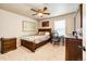 Comfortable bedroom featuring neutral carpet, a ceiling fan, and modern decor at 2177 Shadow Creek Dr, Castle Rock, CO 80104