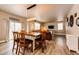 Inviting dining area with stylish lighting, hardwood floors, and seamless flow into the spacious living room at 2177 Shadow Creek Dr, Castle Rock, CO 80104
