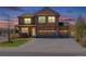 Beautiful two-story home featuring a stone facade and three-car garage on a quiet street at 2177 Shadow Creek Dr, Castle Rock, CO 80104