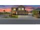 Beautiful two-story home featuring stone accents, well-manicured landscaping, and a three-car garage at 2177 Shadow Creek Dr, Castle Rock, CO 80104